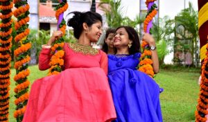 Two young girls enjoying Raja Festival at OTDC in Bhubaneswar on Thursday