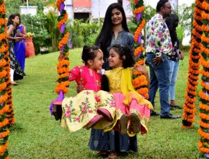 Two small girl enjoying Raja Festival at OTDC in Bhubaneswar on Thursday..