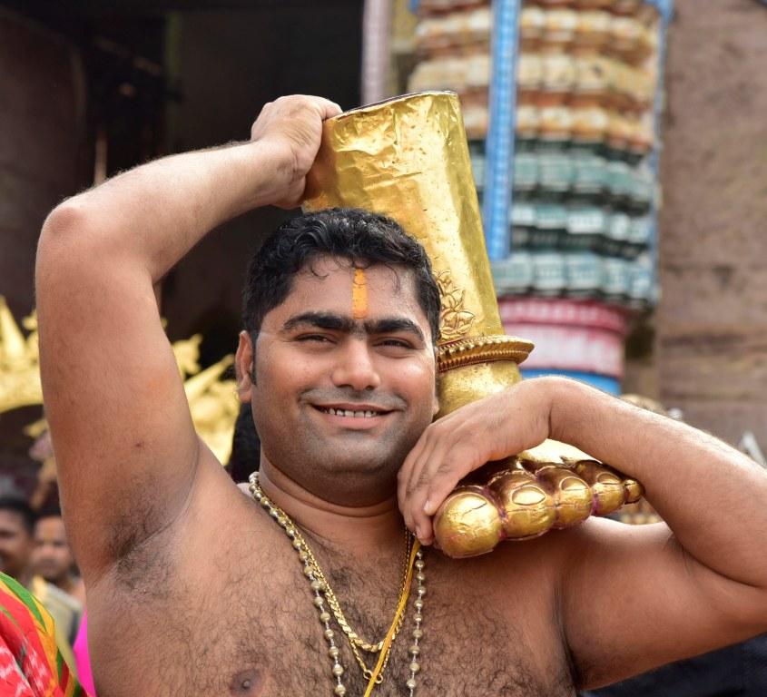 A servitor carrying 'Payara' - a Unique Golden ornament used as the Holy Feet of the Lords during Suna Besha (Golden Attire), an important Ritual of Rath Yatra at Puri